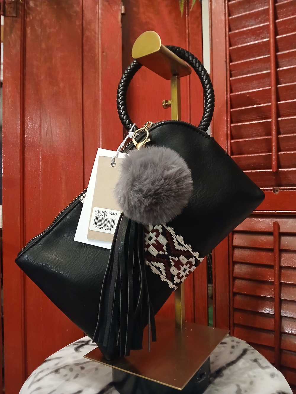 Black Braided-Handle Wristlet Clutch with Gray Pom Charm